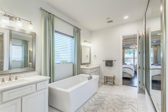 full bath with a sink, visible vents, marble finish floor, and ensuite bath