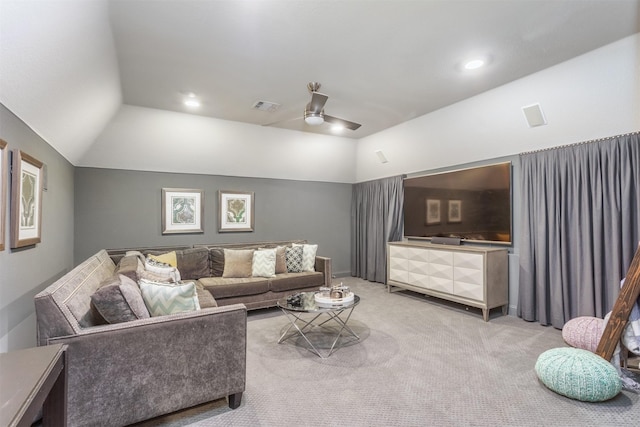 carpeted living area with vaulted ceiling, recessed lighting, visible vents, and ceiling fan