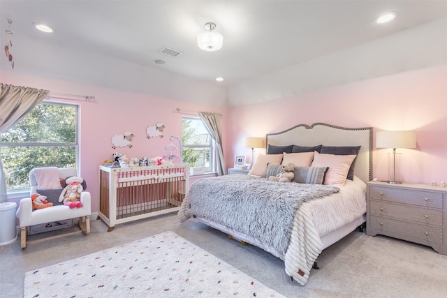 carpeted bedroom featuring recessed lighting, visible vents, and baseboards