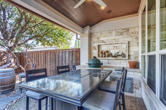 view of patio featuring outdoor dining space and fence