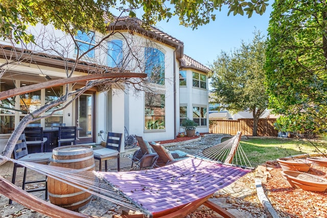 view of patio / terrace featuring fence