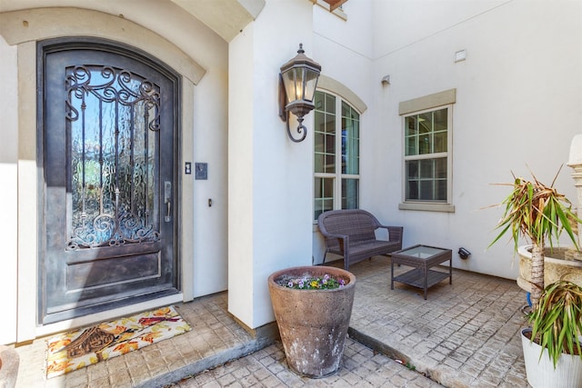 doorway to property with stucco siding