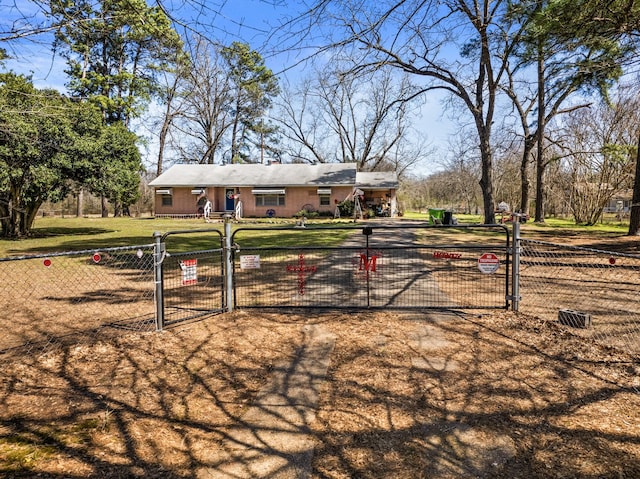 exterior space featuring a fenced front yard, a front lawn, and a gate