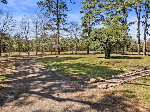 view of home's community featuring a lawn