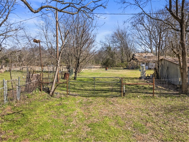 view of yard featuring a gate and fence