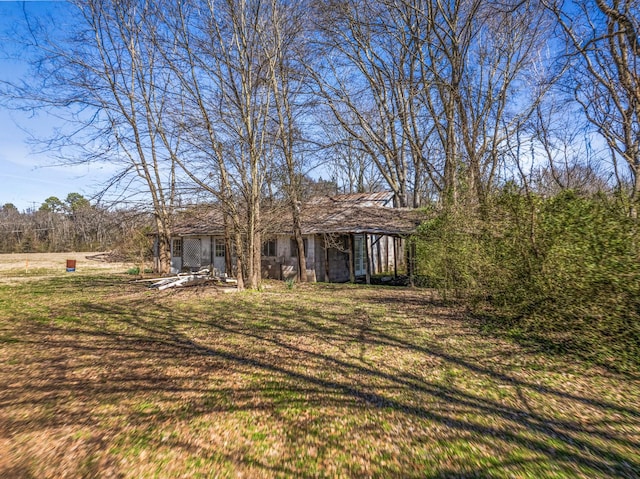 exterior space featuring a patio and a front lawn