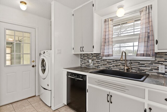 kitchen featuring tasteful backsplash, dishwasher, light tile patterned flooring, white cabinets, and a sink