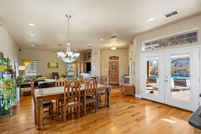 dining room featuring recessed lighting, french doors, visible vents, and light wood finished floors