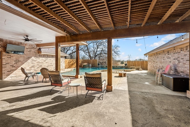 view of patio with a fenced in pool, a fenced backyard, and a jacuzzi