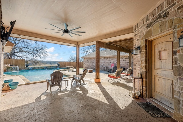 view of patio / terrace featuring a fenced backyard, a fenced in pool, and ceiling fan