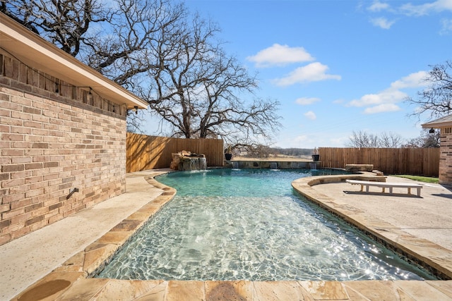 view of swimming pool featuring a patio area and a fenced backyard