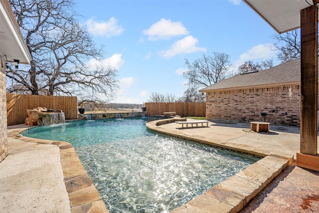 view of pool featuring a fenced backyard, a fenced in pool, and a patio