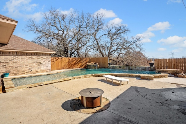 view of swimming pool with a patio area, a fenced in pool, and a fenced backyard