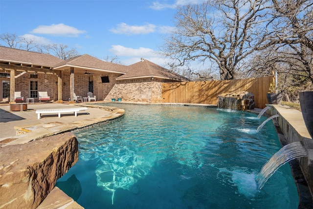 view of swimming pool featuring a fenced in pool, fence, ceiling fan, and a patio area