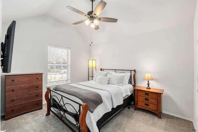 carpeted bedroom featuring baseboards, lofted ceiling, and ceiling fan