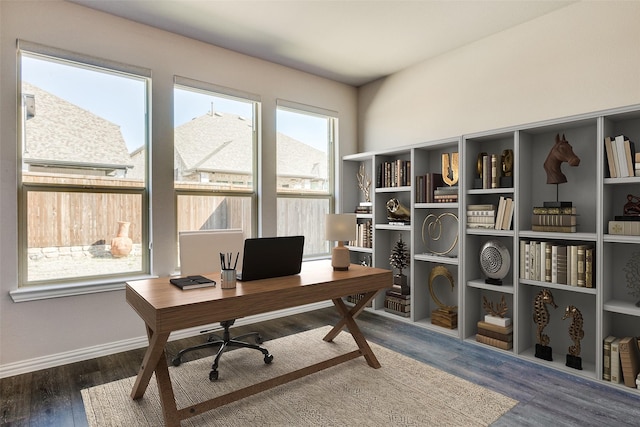 home office featuring baseboards and wood finished floors