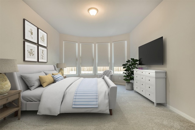 bedroom featuring light carpet and baseboards