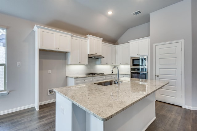 kitchen with visible vents, a sink, white cabinets, under cabinet range hood, and appliances with stainless steel finishes