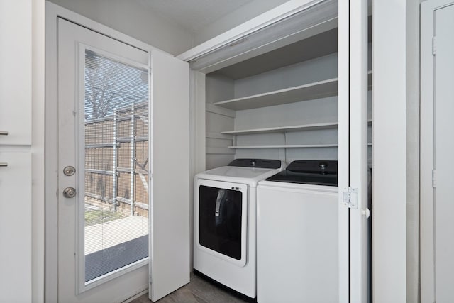 clothes washing area with laundry area and separate washer and dryer