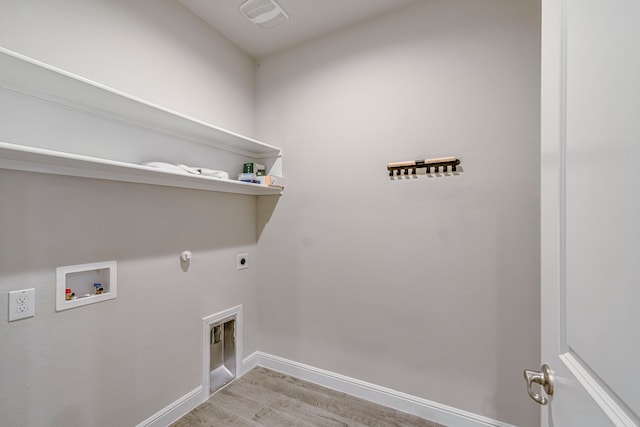 laundry area with baseboards, gas dryer hookup, laundry area, electric dryer hookup, and washer hookup