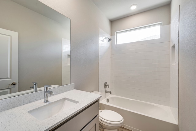 full bath featuring toilet, vanity, and  shower combination