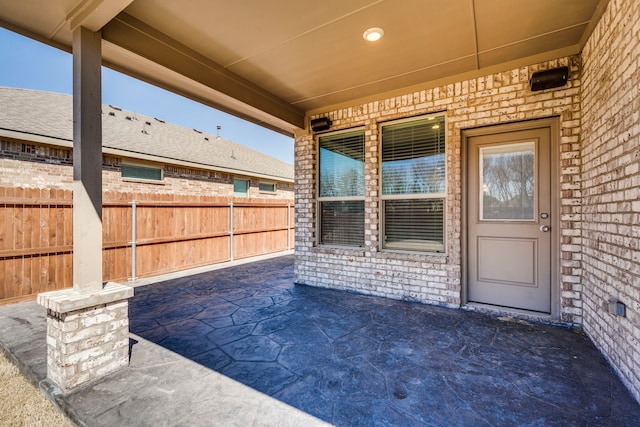 view of patio featuring fence