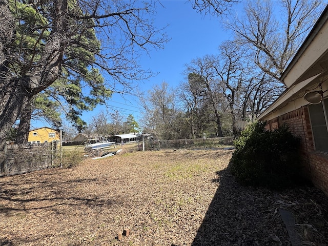 view of yard featuring fence