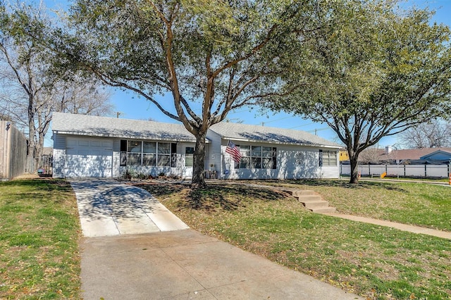 ranch-style home with an attached garage, concrete driveway, a front lawn, and fence