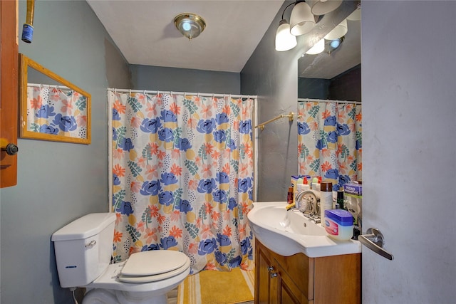 full bath with a shower with shower curtain, toilet, and vanity