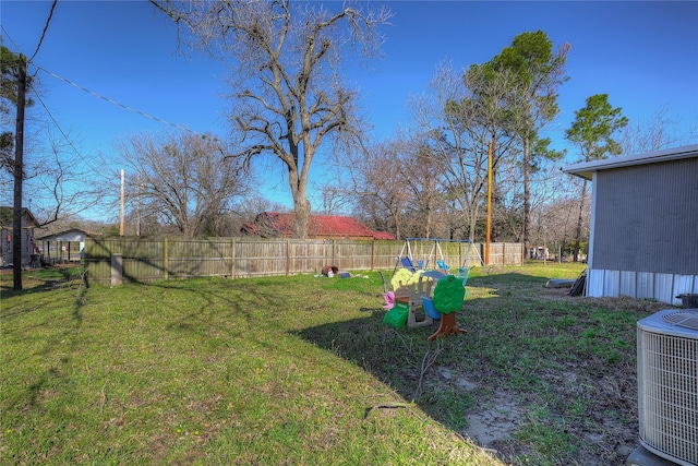 view of yard with cooling unit and fence