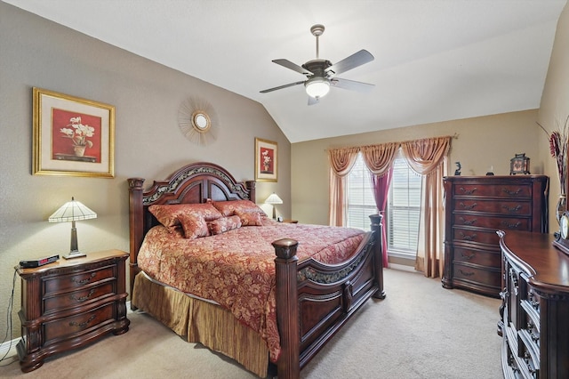 bedroom with carpet flooring, ceiling fan, and lofted ceiling