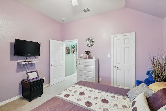 carpeted bedroom with visible vents, a ceiling fan, baseboards, and vaulted ceiling