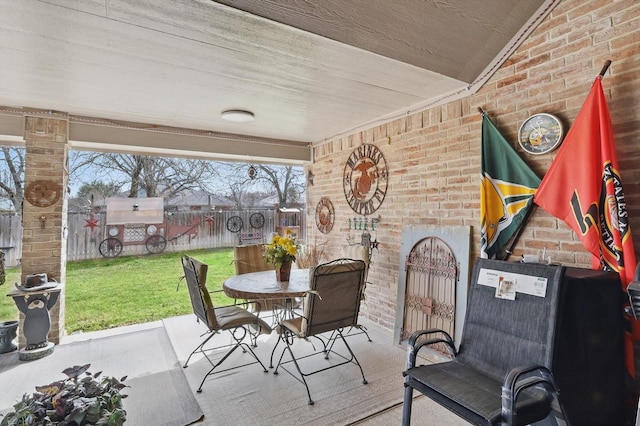 view of patio / terrace with outdoor dining space and fence