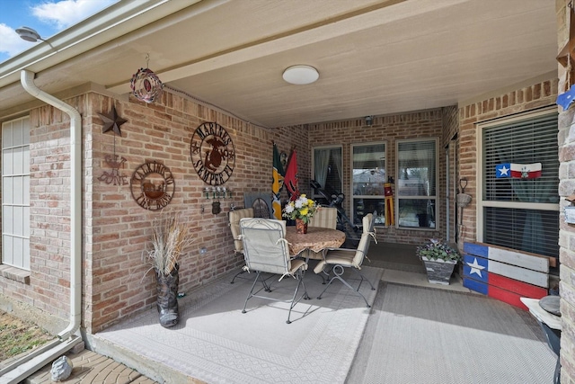 view of patio featuring outdoor dining area