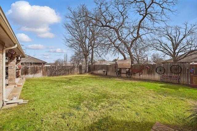 view of yard with a fenced backyard