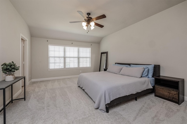 bedroom with ceiling fan, baseboards, lofted ceiling, and carpet