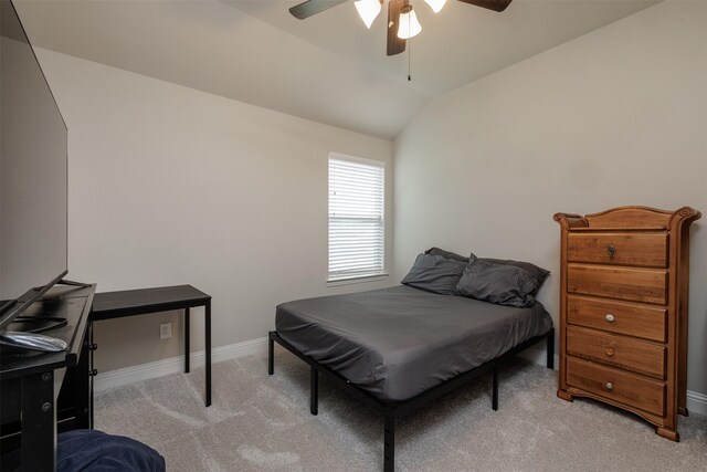 bedroom with baseboards, carpet, ceiling fan, and vaulted ceiling