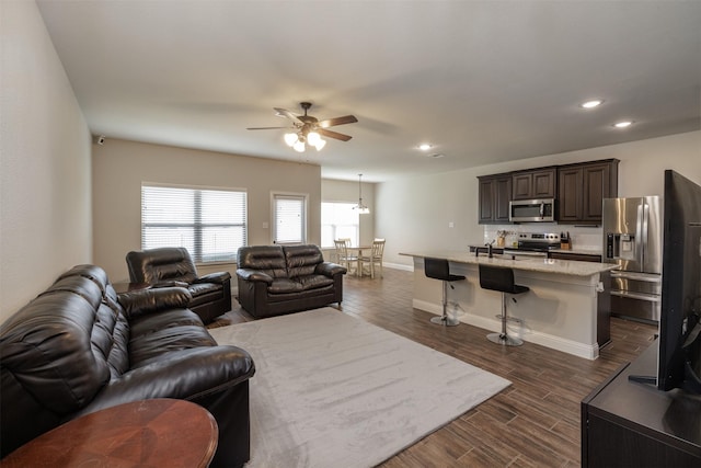 living area featuring dark wood-style floors, recessed lighting, a ceiling fan, and baseboards