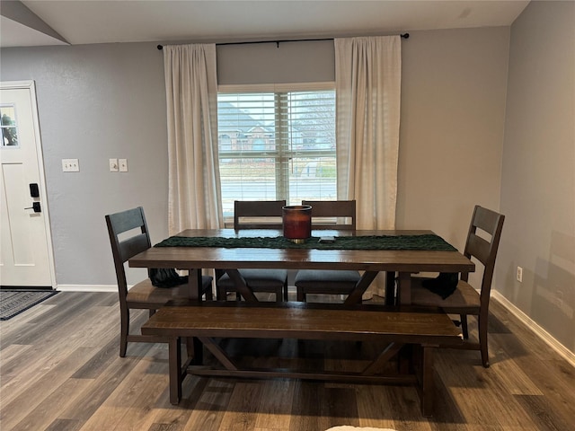 dining room with wood finished floors and baseboards