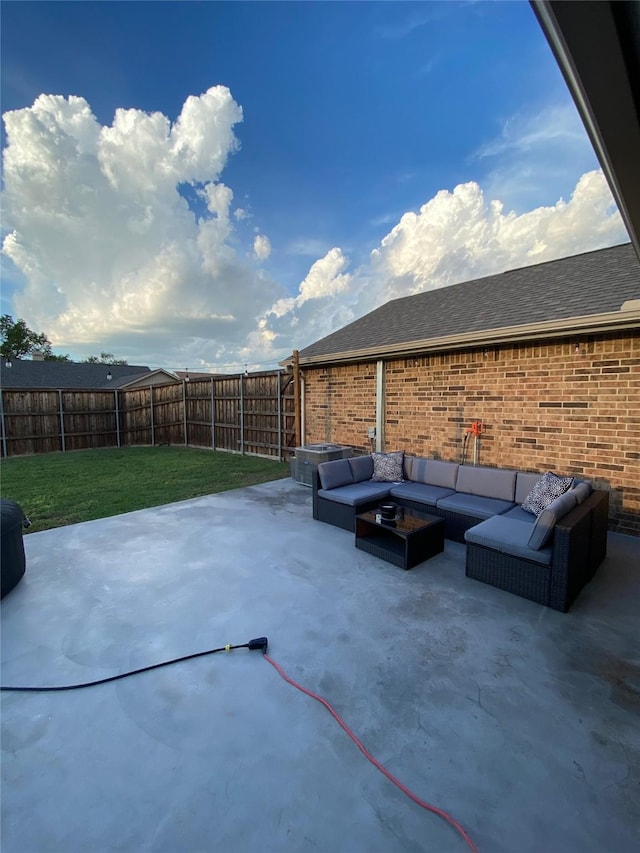 view of patio with an outdoor living space and a fenced backyard