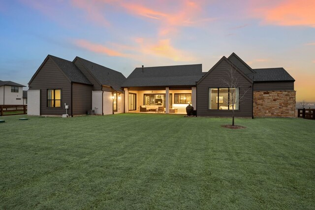 900 Sutherland Cres, Northlake, TX 76247 - patio terrace at dusk featuring a patio area, an outdoor living space with a fire pit, and a fenced backyard