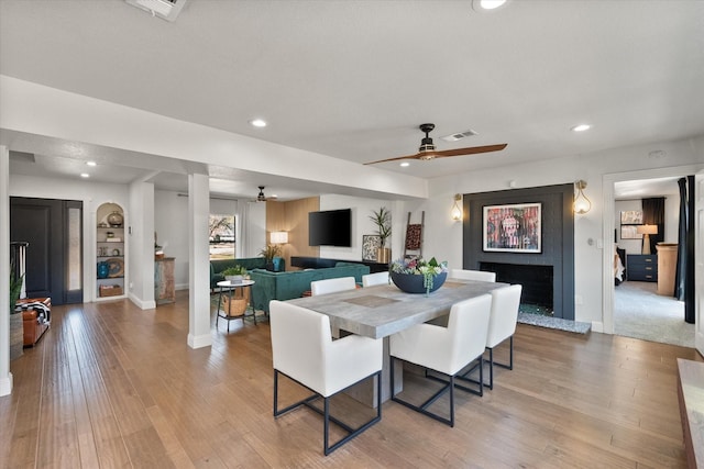 dining space with visible vents, recessed lighting, ceiling fan, and wood finished floors