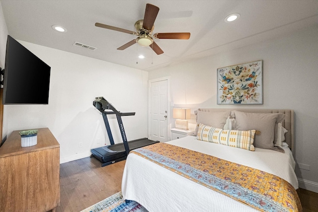 bedroom with visible vents, a ceiling fan, wood finished floors, recessed lighting, and baseboards