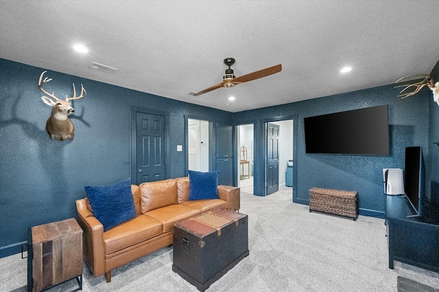 living room with visible vents, a textured ceiling, recessed lighting, carpet floors, and ceiling fan