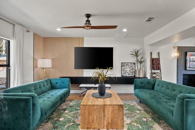 living room featuring visible vents, recessed lighting, ceiling fan, and wood finished floors