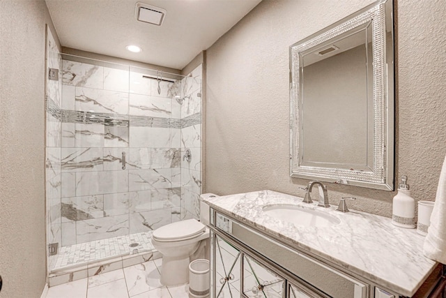 full bath with toilet, marble finish floor, a shower stall, and a textured wall