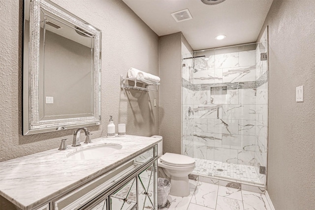 bathroom featuring visible vents, a stall shower, toilet, a textured wall, and marble finish floor