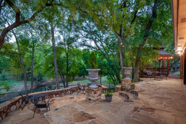 view of patio / terrace with a gazebo and fence