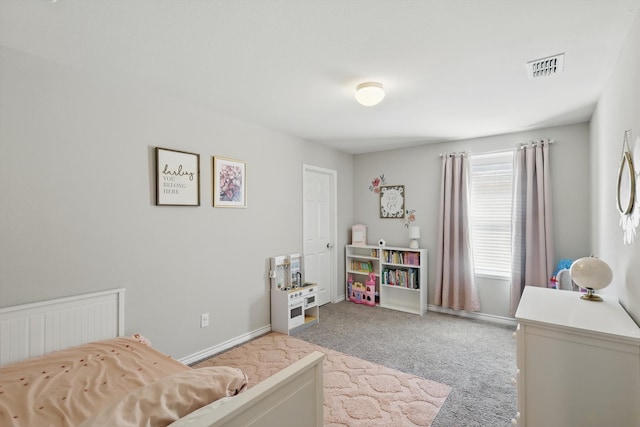 carpeted bedroom with baseboards and visible vents