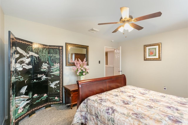 bedroom featuring visible vents, carpet floors, and ceiling fan